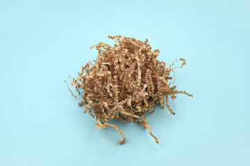 The shredded paper on light blue background.