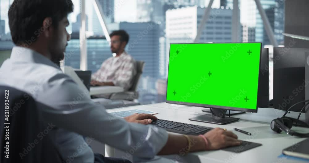 Aufkleber indian chief financial officer working on desktop computer with green screen mock up display. young 
