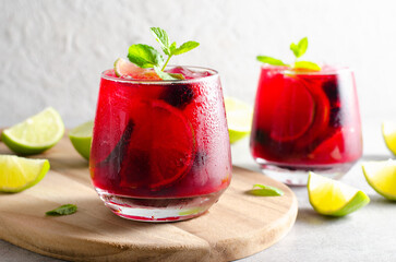 Berry Lemonade, Refreshing Drink, Cocktail, Iced Tea, Blackberry and Lime Summer Drink on Bright Background