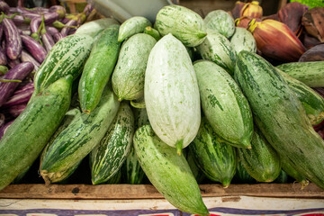 Fresh zucchini on display at a farmers market