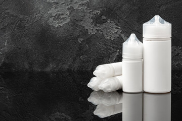Electronic cigarette vape liquids on black background
