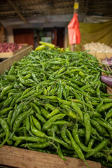 Green chilli peppers at a market 