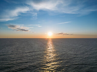 Beautiful sunset in the Baltic Sea in summer, view from a drone.