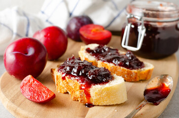 Bread Toasts with Plum Jam, Delicious Homemade Plum Jam on Bright Background