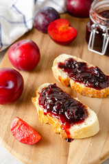 Bread Toasts with Plum Jam, Delicious Homemade Plum Jam on Bright Background