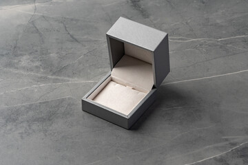 Small jewelry box on gray background close up