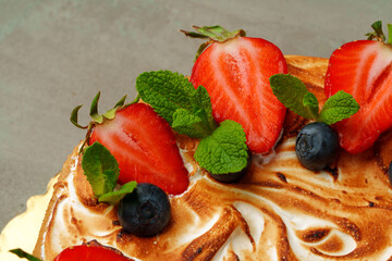 Delicious cake on gray background close up