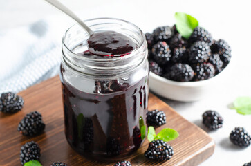 Blackberry Jam in a Jar, Delicious Homemade Berry Jam on Bright Background