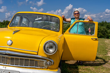 woman with yellow retro car