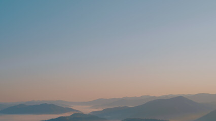 Carpathian mountains with fog at sunrise