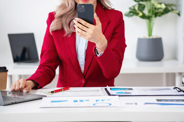 Consultant, Asian businesswoman working on the phone who discussion financial work and marketing...