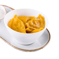 Tasty dumplings in bowl with sour cream