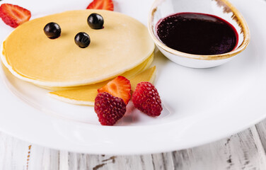 Baby cat pancake on a white plate