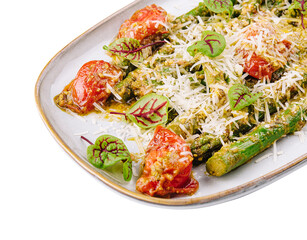 Baked asparagus with cherry tomatoes top view
