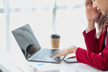 Concept Burnout Syndrome. Asian business Woman feels uncomfortable working. Which is caused by...