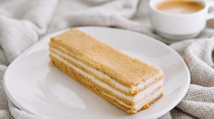 Fototapeta na wymiar Napoleon cake slices with cup of coffee