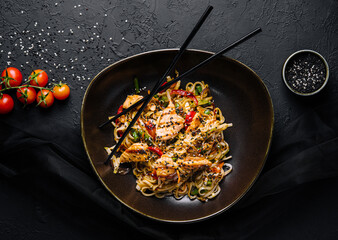 Fried noodles with chicken and vegetables. chicken chow mein