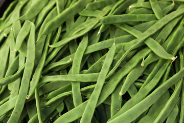 green romano beans on the counter in the market