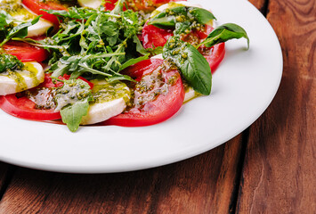 Traditional italian caprice salad tomato, mozzarella cheese and basil