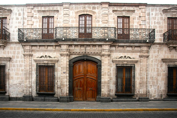 White walls and doors of the old streets of the city of Arequipa in Peru.