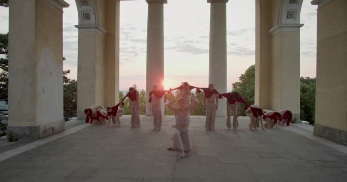 Modern interpretive dancing, tied together shirts on young people, 4k