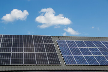 Fototapeta premium House roof with photovoltaic modules.