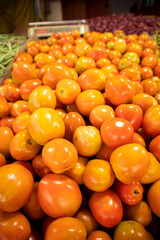 Colorful tomatoes on the counter of a market