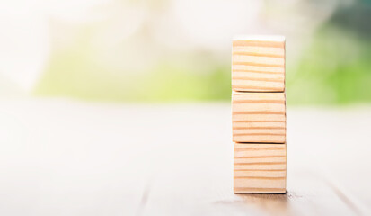 Ladder career path for business growth success process concept. Wooden blocks are stacked in steps that continue to rise. Copy space