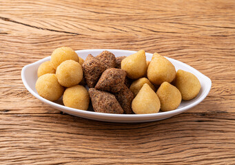 Coxinha, kibbeh and cheese balls, typical brazilian snacks