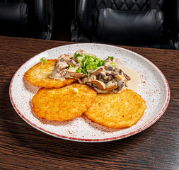 potato pancakes with sour cream and meat