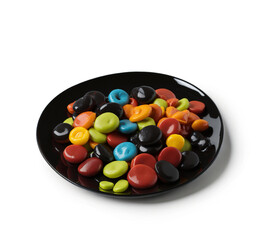 Colorful Candies in Black Plate on White Background