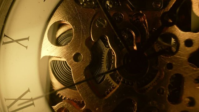 Macro mechanical vintage watch. Arrow, gears rapidly rotating. Time running fast