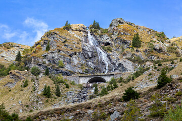 Waterfalls and mountain bridges in the mountains. Beautiful landscape nearby Transfagarashan highway in Carpathian mountains