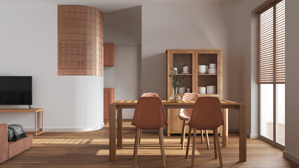 Minimal dining and living room in white and orange tones. Wooden table with chairs, glass block wall over kitchen. Cabinets and sofa. Scandinavian modern interior design