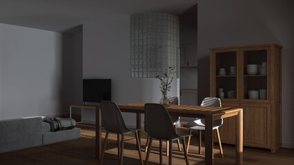Dark late evening scene, japandi wooden dining and living room Table with chairs, glass block wall over kitchen. Cabinets and sofa. Minimal interior design