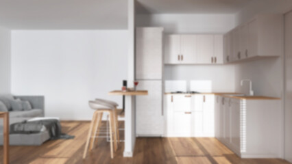Blurred background, modern wooden kitchen and living room. Partition wall wall over cabinets, island with stools. Sofa and parquet floor. Minimal wooden interior design