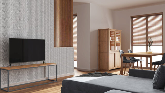 Minimal wooden dining and living room in white and gray tones. Velvet sofa, partition wall and television stand. Cabinets and table. Scandinavian interior design
