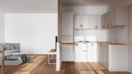 Blurred background, modern scandinavian kitchen and living room. Partition wall, cabinets and...