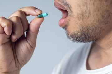 an taking antibiotics, close up health care concept