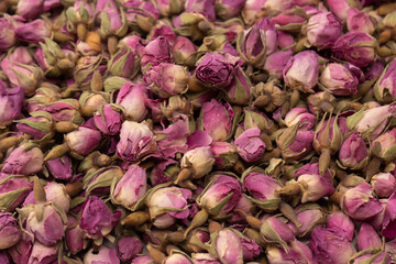 Dry tea roses isolated on white background.