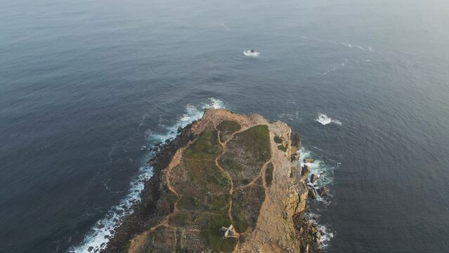 Aerial view of Ilheu da Papoa, a small island in Peniche facing the Atlantic Ocean, Leiria, Portugal.