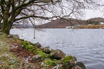 Rope swing over the water in Badachro, Scotland.