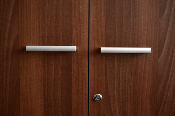 Obraz premium Office furniture. A brown box for documents. The handles are at the old drawer.