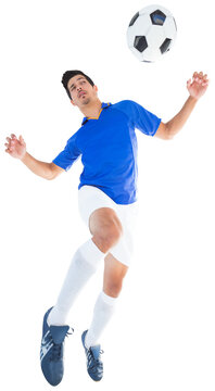 Digital png photo of hispanic footballer jumping to ball on transparent background
