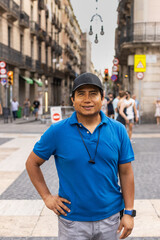 Street portrait of a smiling Peruvian man in the city.