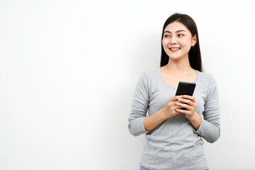 Fototapeta premium Model asian woman emotion happy and excited to win prizes with online lottery tickets on their mobile phones.