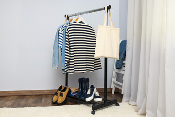 Wardrobe rack with different clothes, concept of different clothes