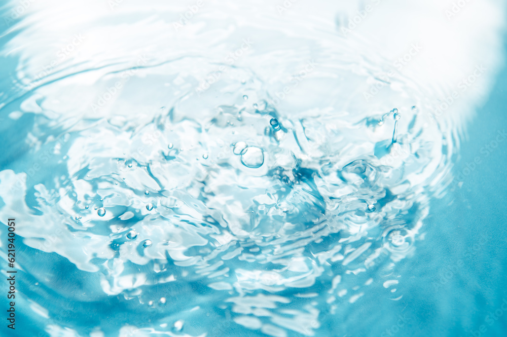 Poster defocus blurred blue color water ripple surface clear calm texture background with splashing bubbles