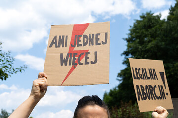 Placard signs supporting abortion rights in Poland. Women's Strike protest rally demonstration after death of young pregnant woman. Ani jednej więcej is Not one more. Legalna aborcja is Legal abortion