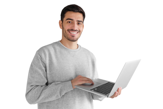 Portrait of young man in gray sweatshirt standing, holding laptop and watching media with happy smile